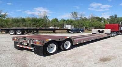 the image consists of Stretch RGN trailer that is designed to carry and haul freights